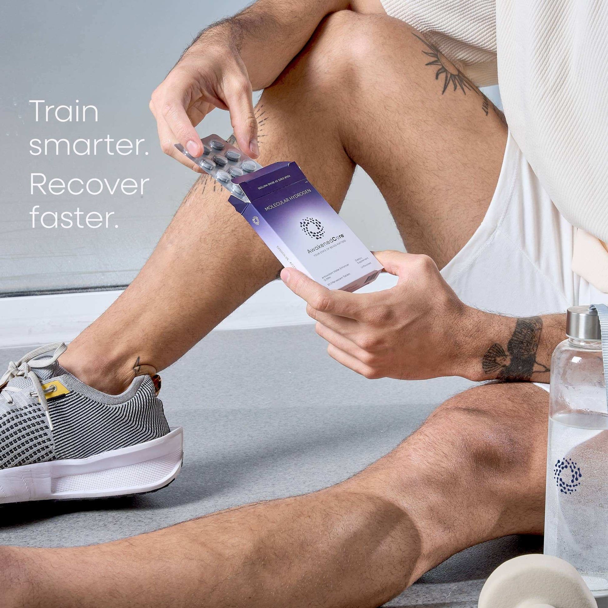 Person holding a purple container with text 'Train smarter. Recover faster.' on a gray background
